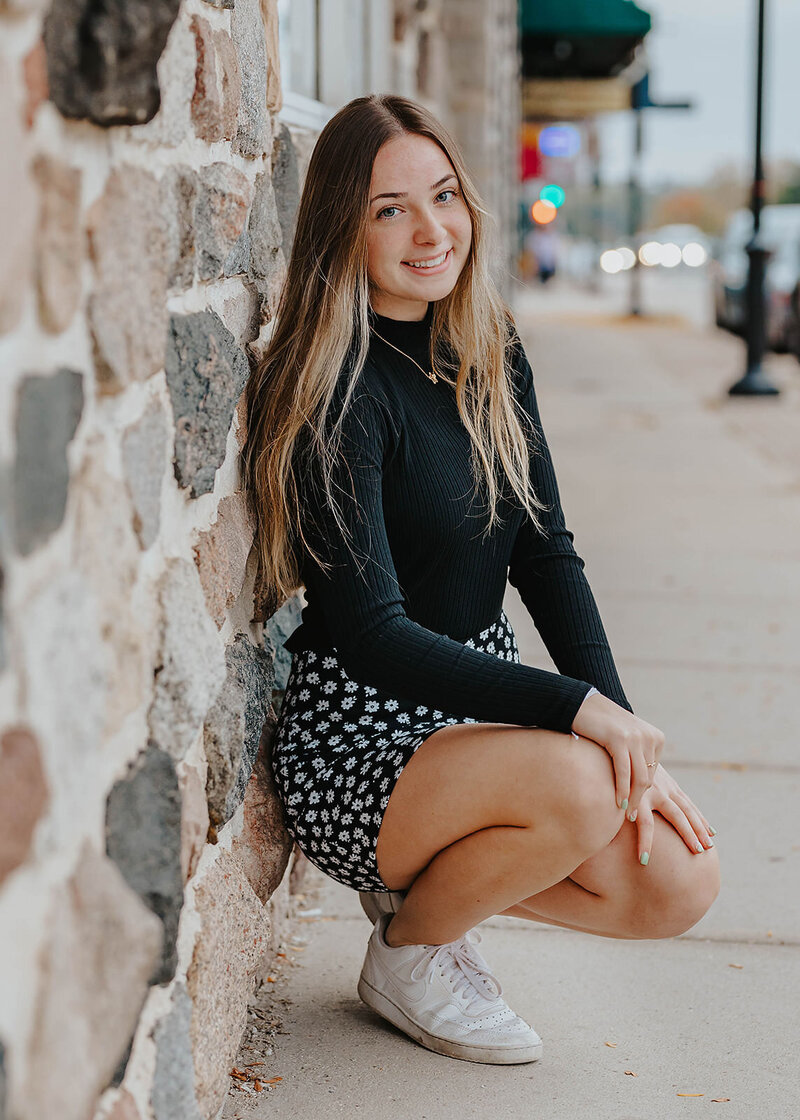 woman posing by wall