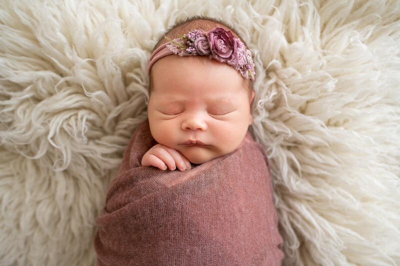 Ripon Wisconsin Newborn Photo session baby posed on fur during studio session | Glory Be Photography by Tara Bos