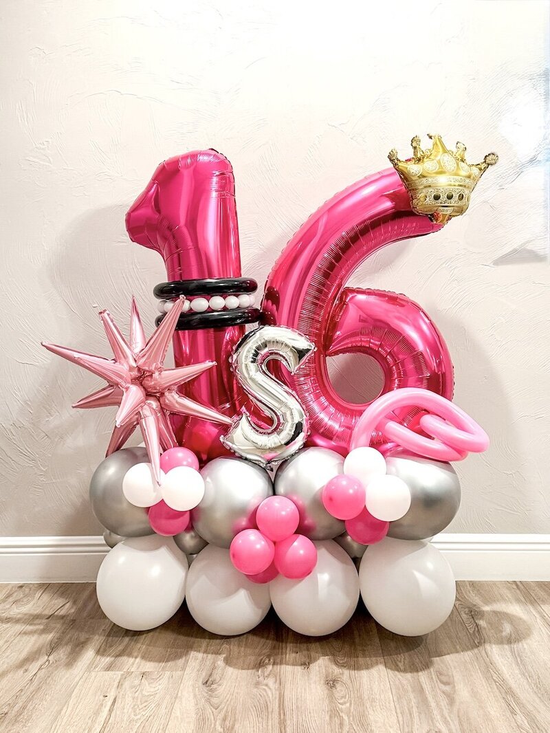pink, silver, and white balloons in a sweet sixteen number stack bouquet in Fort Myers