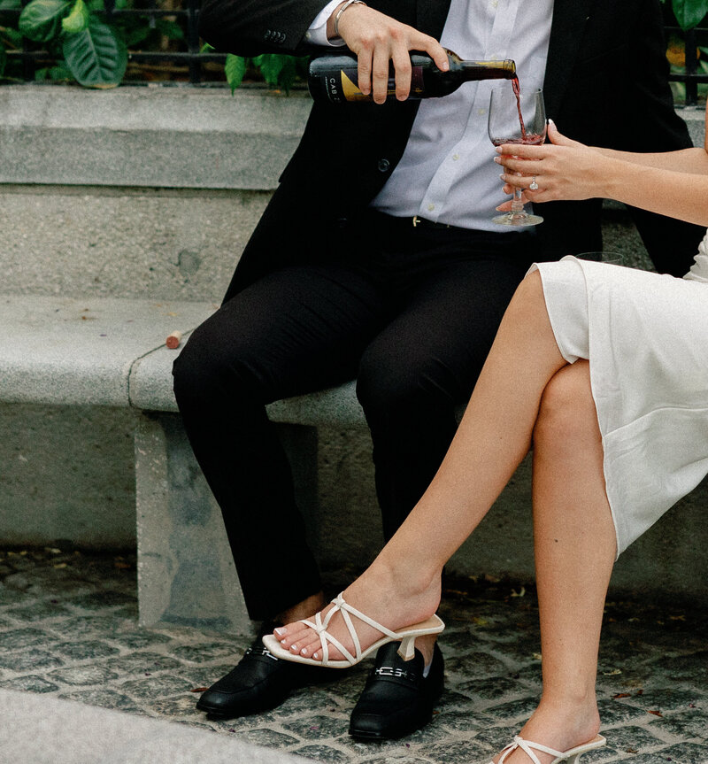 engagement photos pouring wine taken by tampa florida wedding photography