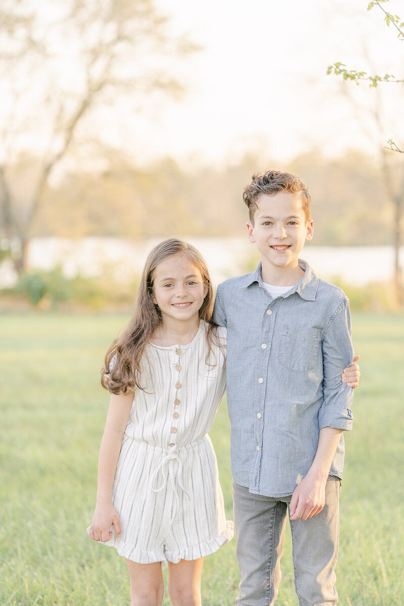 siblings pose for picture taken by Haymarket, VA spring mini session photographer