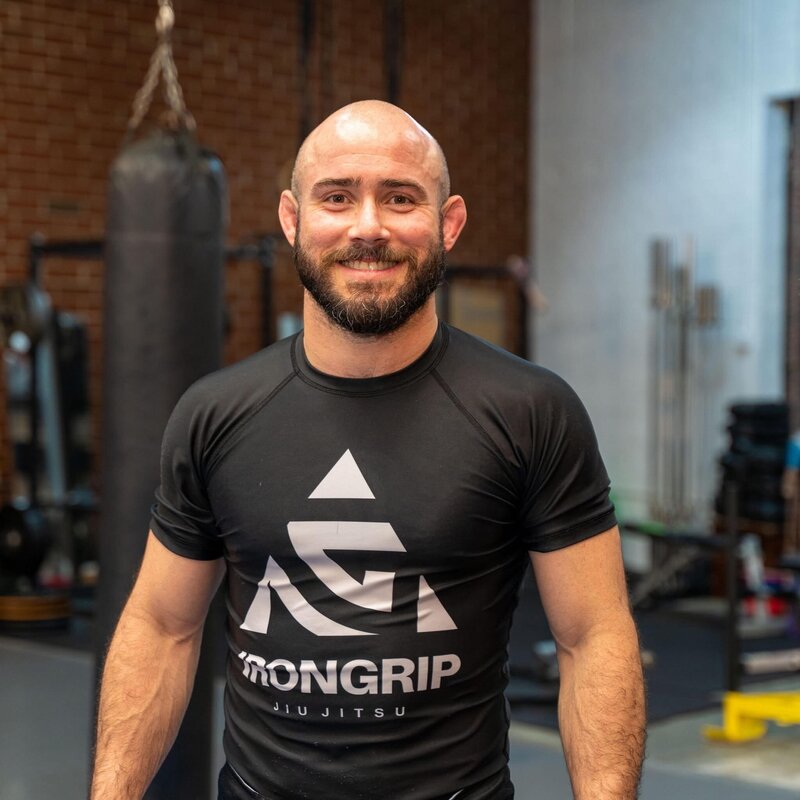 Photo of IRONGRIP founder Glayton Melo smiling at camera