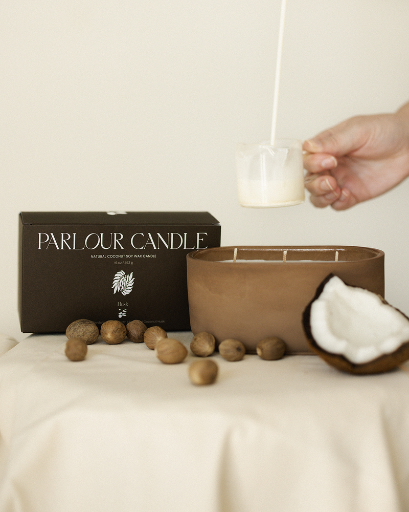 Parlour Candle is a handcrafted candle and home decor line created in a 100-year-old studio space. Using 100% natural coconut soy wax and high-quality, paraben- and phthalate-free fragrance oils, each candle vessel and decor piece is handmade with natural earth pigments and concrete. The line emphasizes sustainability, featuring fully recyclable vessels and no excess plastic in the packaging.