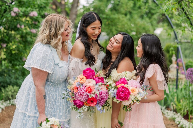 Bridesmaids with colorful spring flowers at the Rosarium Garden Spokane
