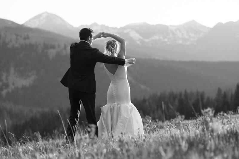 bride and groom share private first dance in Colorado mountains.