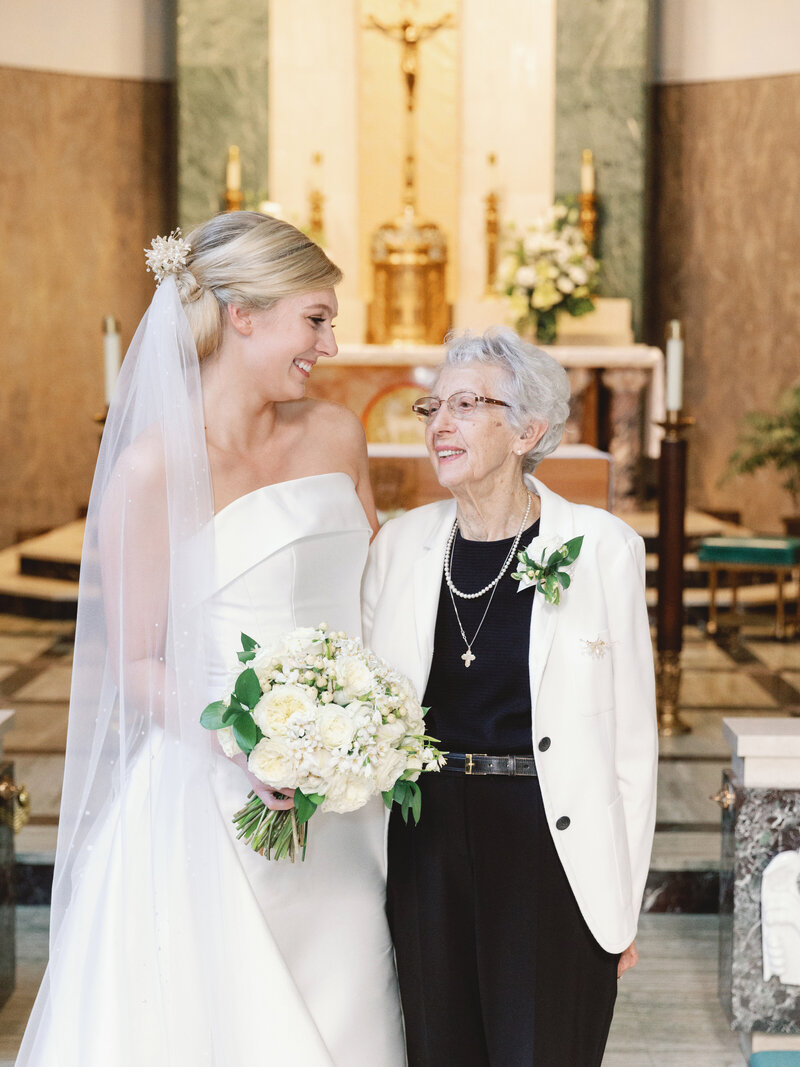 1950's vintage heirloom restyle with wax flower crown being worn on modern bride and her Grandma
