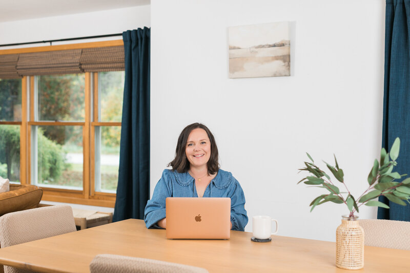 a facebook ads manager sitting with her laptop