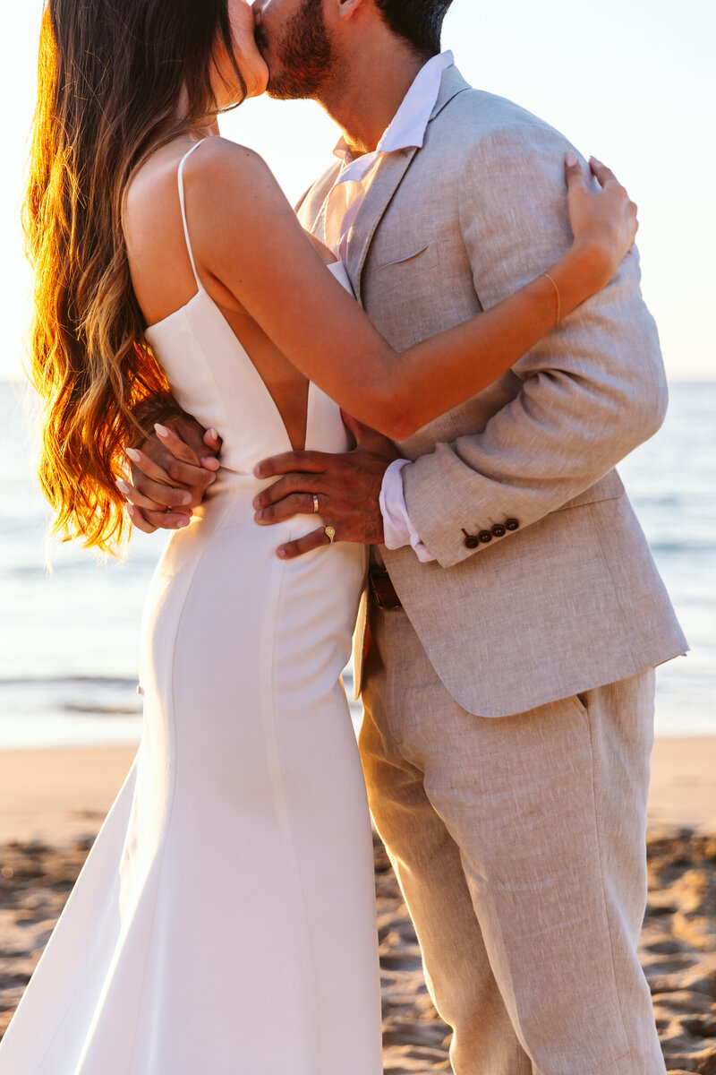 Elopement couple kissing on the beach - The Big Island, Hawaii