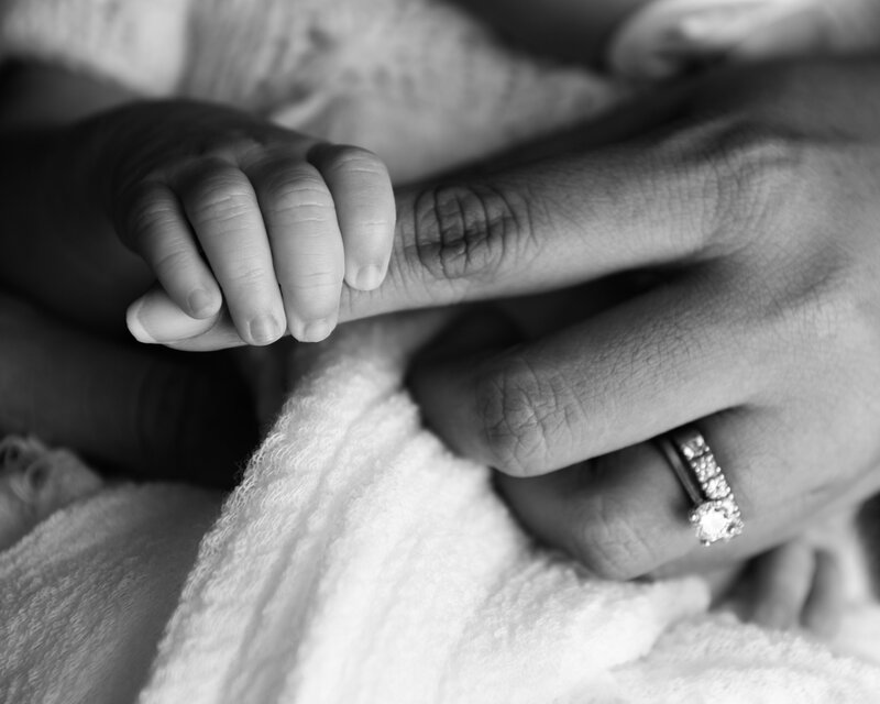 A close-up portrait capturing the emotional bond between mother and baby. Timeless and tender, this image reflects the love that begins at first touch.