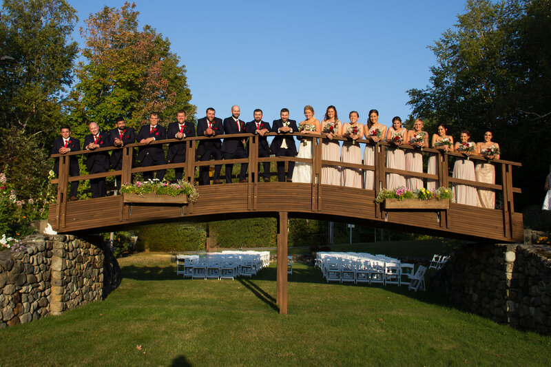 Wedding Party standing on bridge | Sugarloaf Maine Wedding