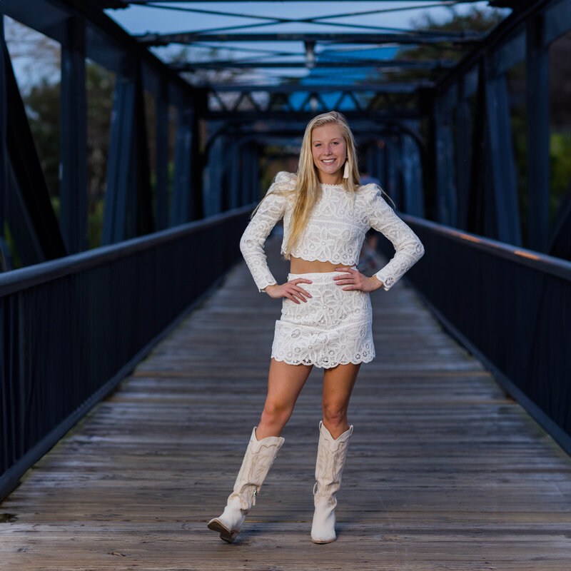 A girl taking her senior portrait at Riverfront Park in downtown Columbia, South Carolina