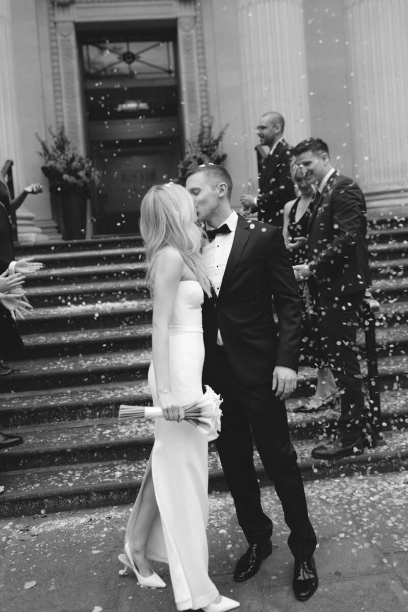 Fashion-forward London wedding photographer documenting modern couple in city streets