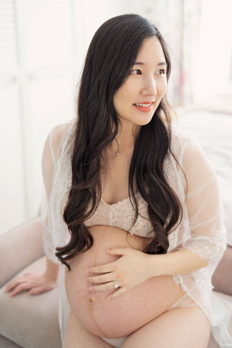 Softly lit photograph of pregnant lady using natural light