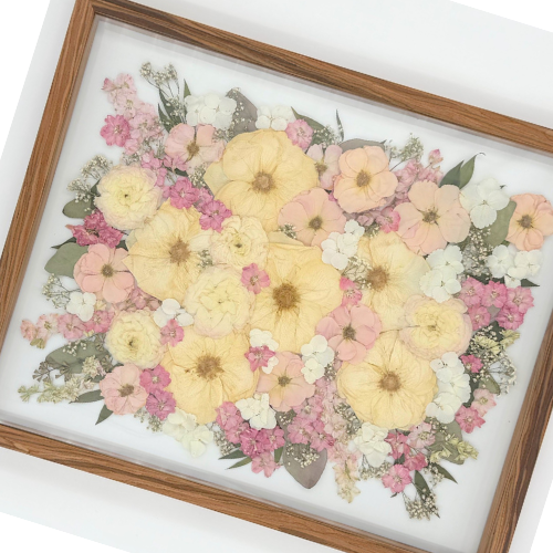 Close-up detail of preserved wedding bouquet flowers in a custom shadow box, Granbury TX