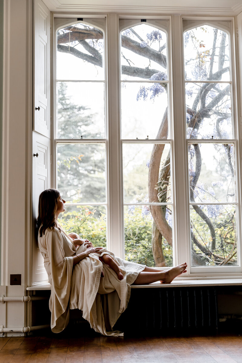 Content Mother with baby during a photoshoot on location