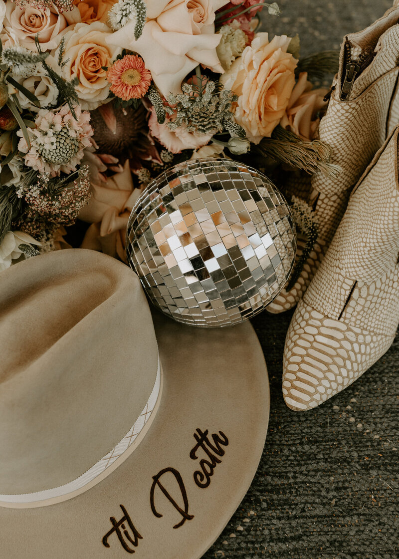 Joshua Tree elopement Wedding Details, Boots, florals, disco ball