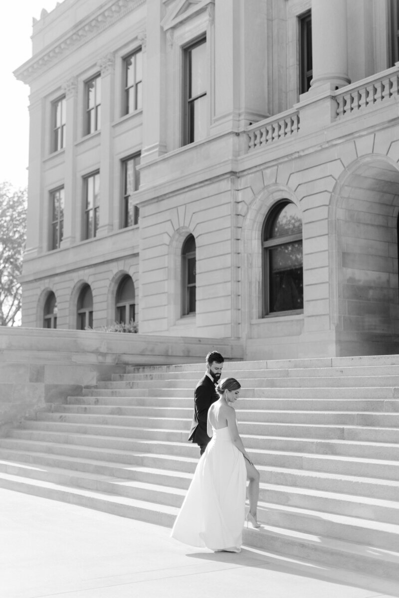 Bride and Groom walking up stairs in downtown nebraska