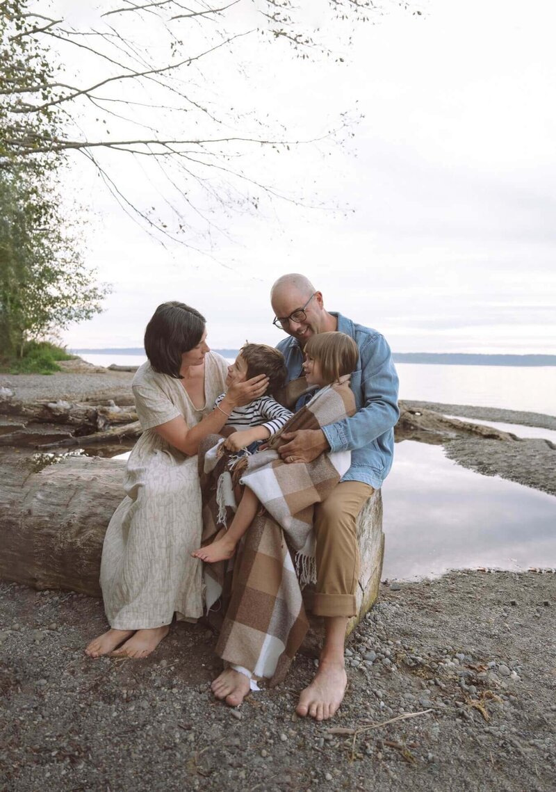 family of four at beach location