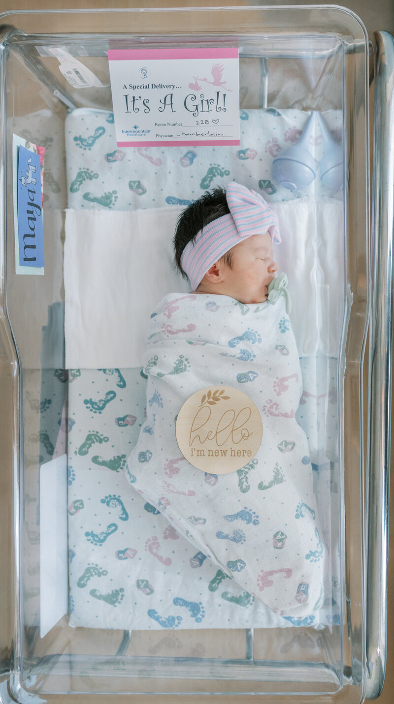 baby girl in hospital bassinet