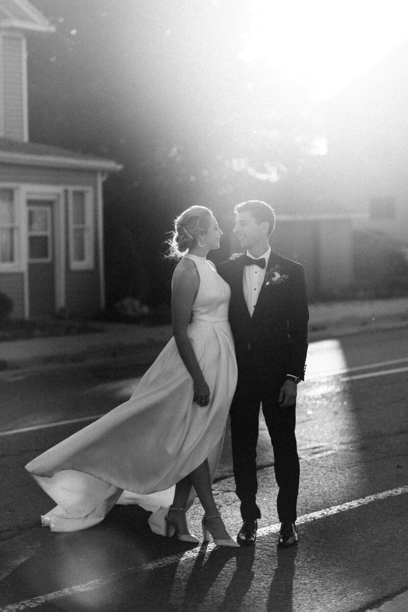 bride and groom running on beach in  goderich