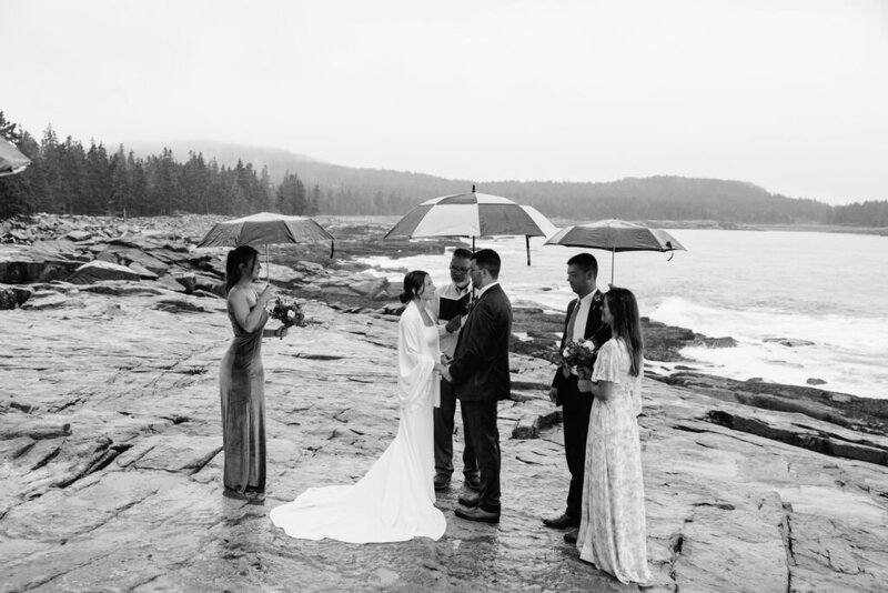 couple getting married in the rain
