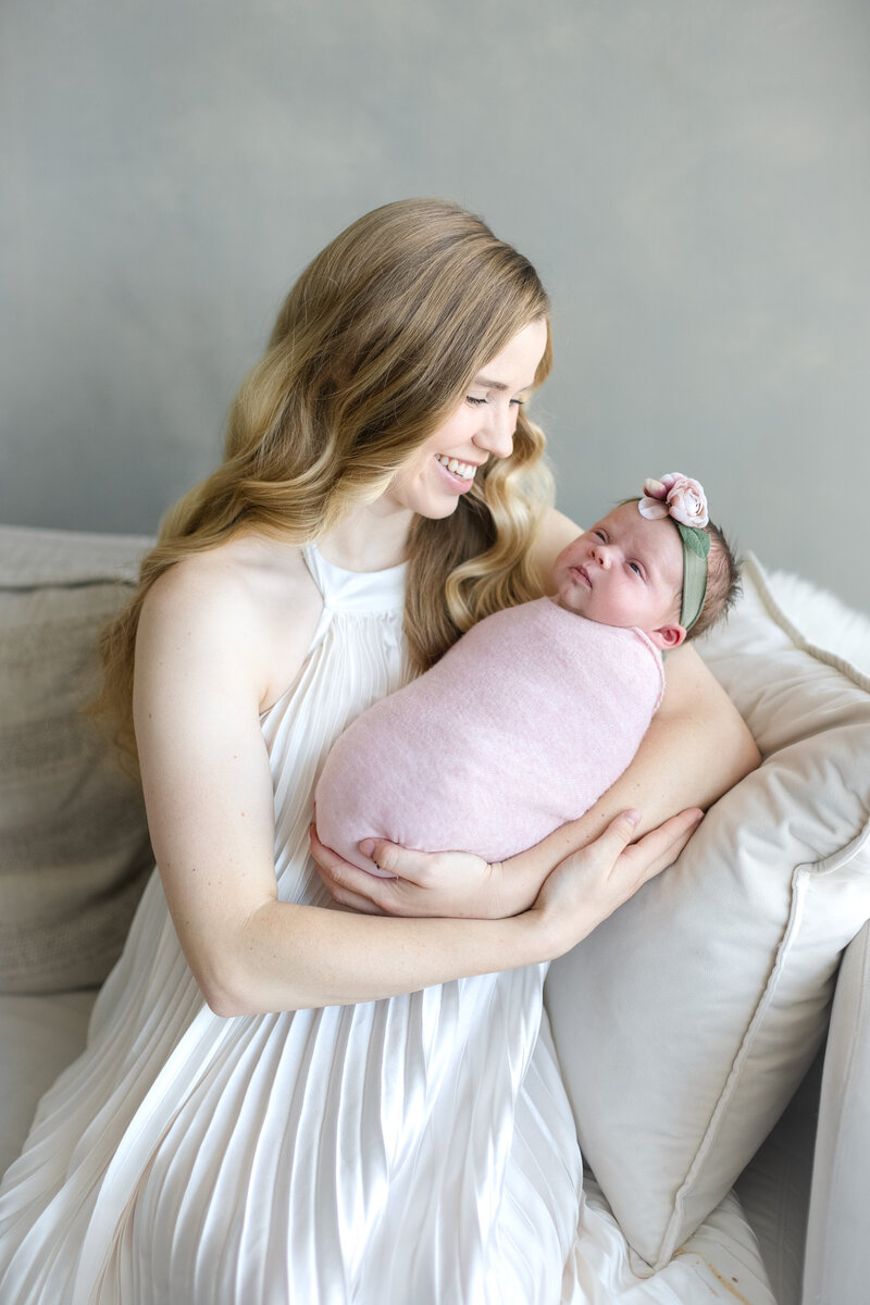 In-studio Maternity Session with floor floral arrangments for mother's day minis photoshoot