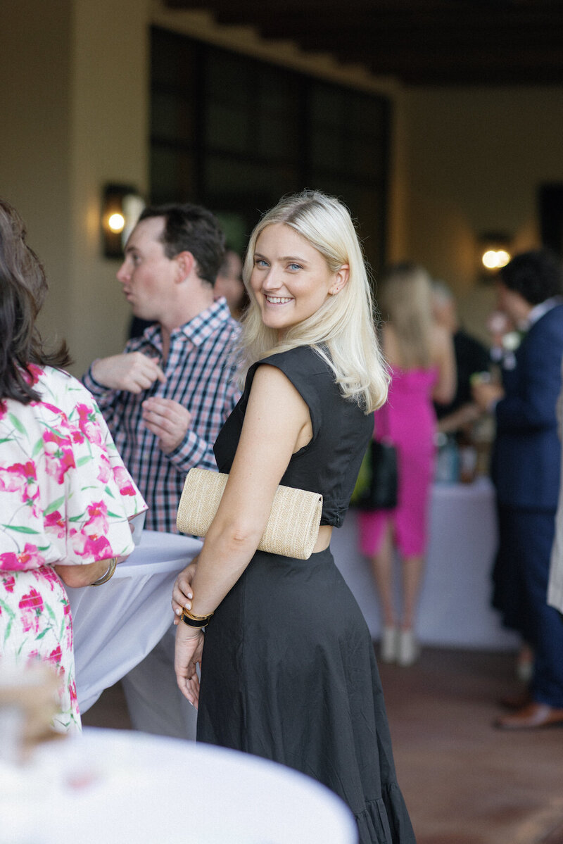 Candid cocktail hour moments on the lawn at Canyonwood Ridge wedding
