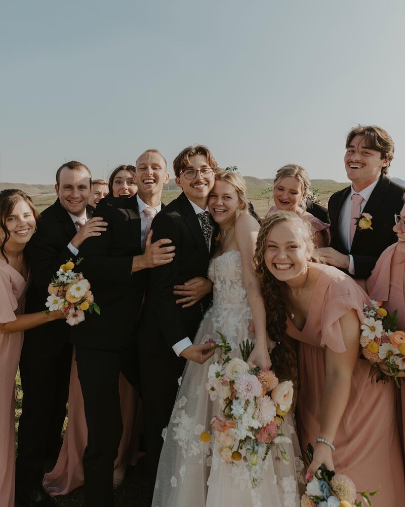 The wedding party poses for a group photo at the August House Venue in Dickinson, North Dakota.