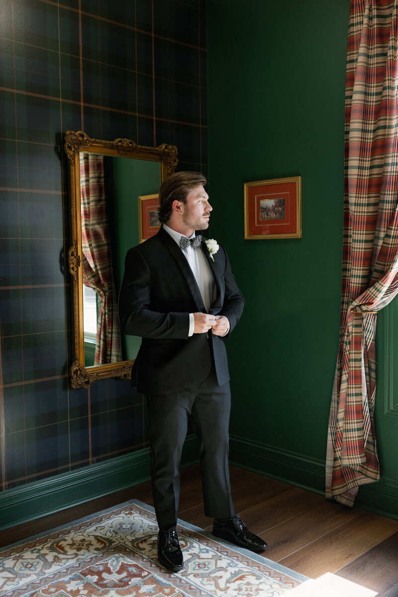 Groom in the getting ready suites at Blackberry Ridge wedding venue