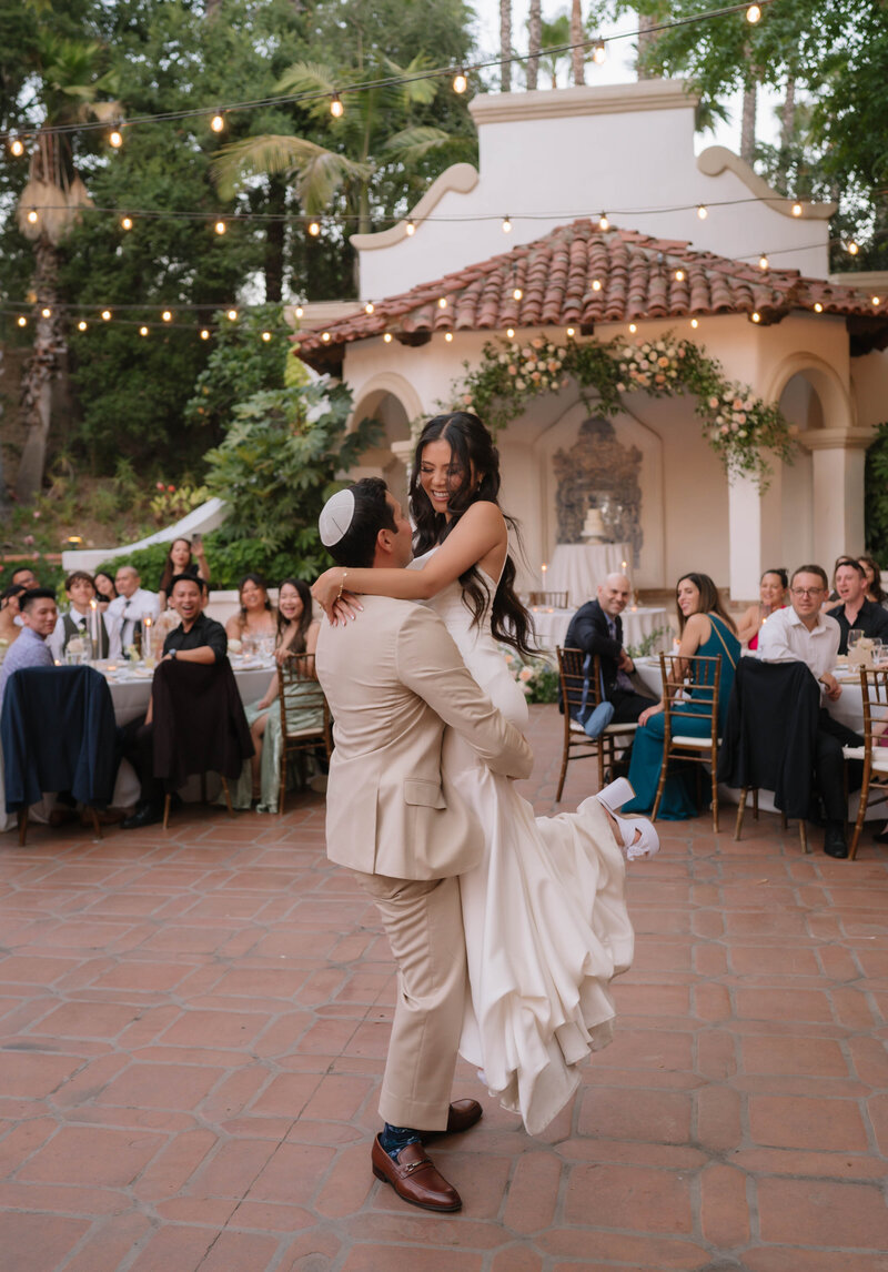 couple holding hands running