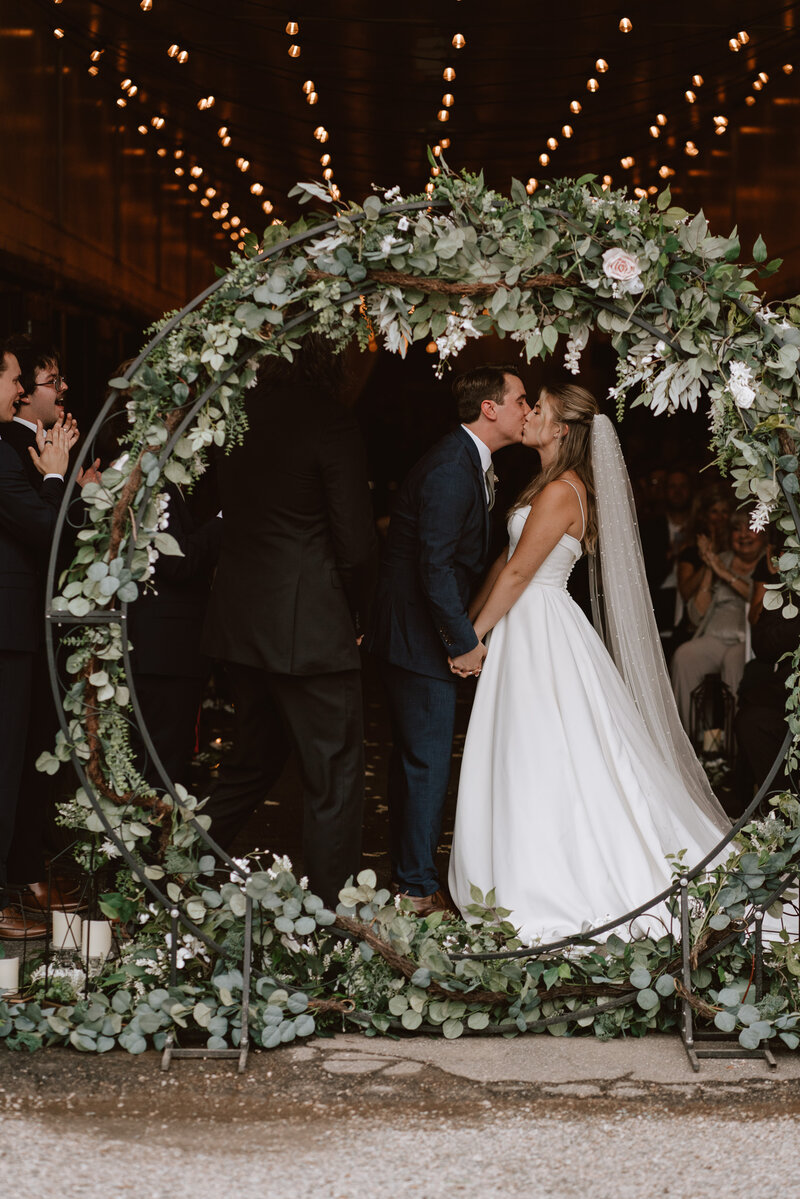 bride and groom kissing