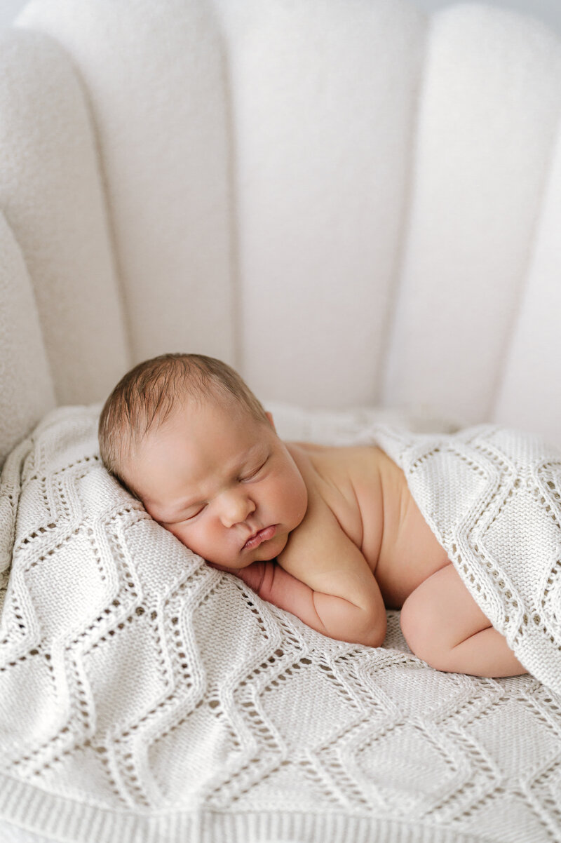 Sleeping baby unknowingly poses for the camera