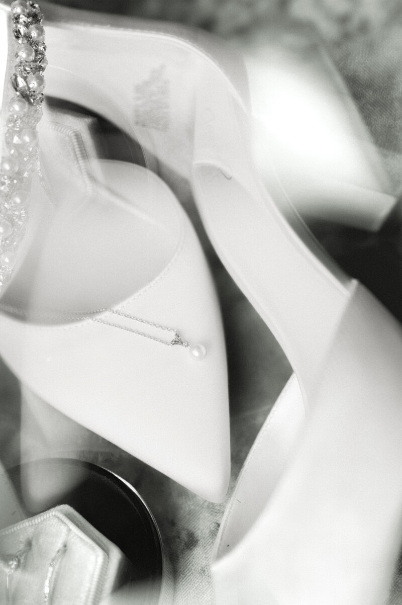 black and white modern wedding photos 2025 of bridal details, shoes, jewelry, rings by austin wedding photographer