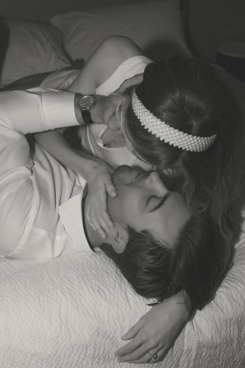 photo of couple kissing in hotel during chic elopement