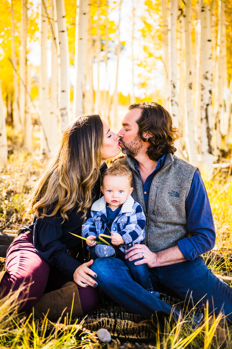 Flagstaff family autumn fall leaves aspens kissing over son
