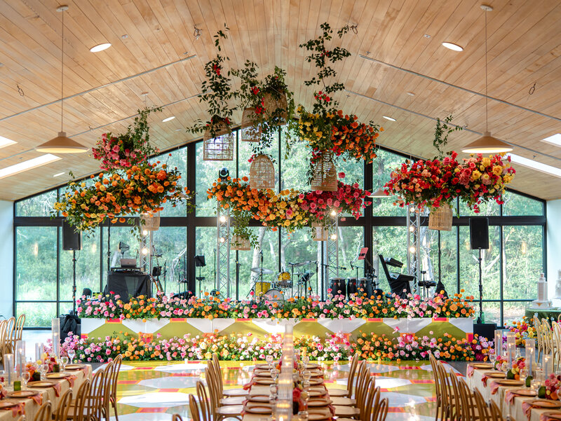 Flat lay of wedding details on a floral background at wedding planned by Bianca Nichole and Co