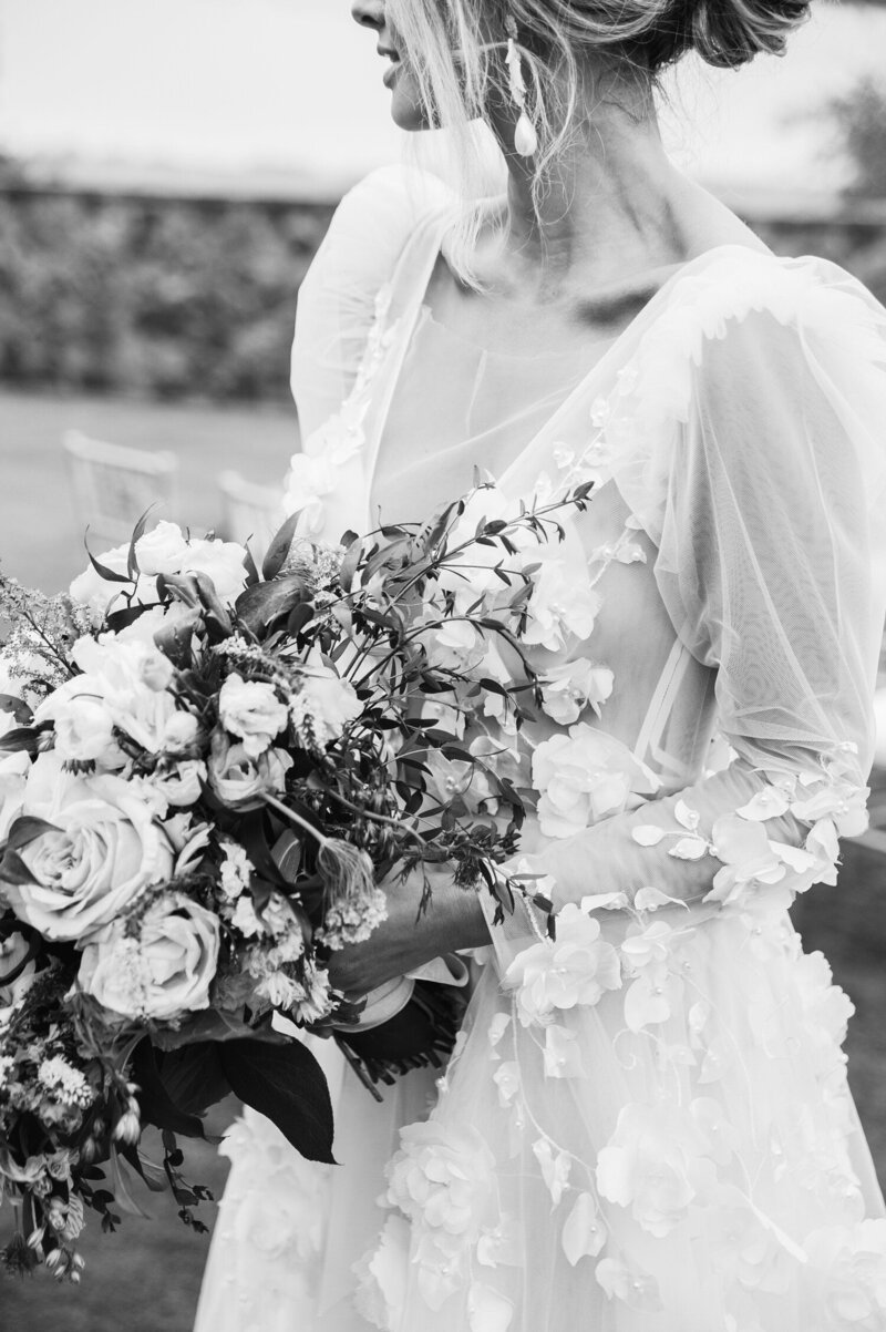 candid portrait of a bride holding her bouquet