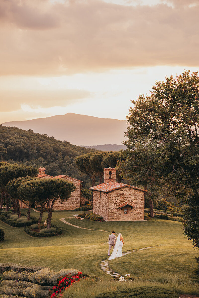 wedding couple hold hands and walk together