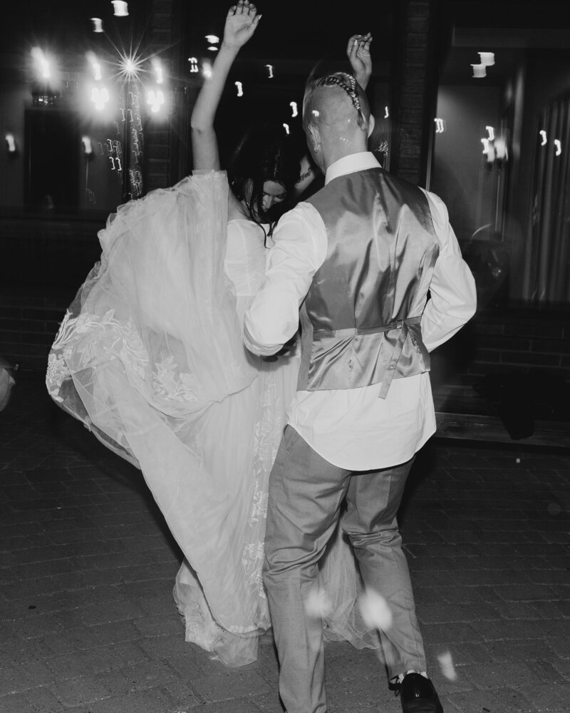bride and groom dancing together