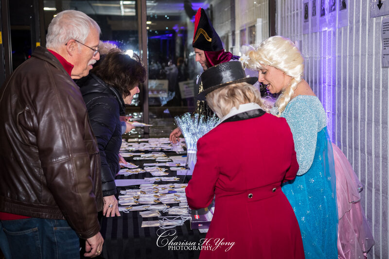 A group of volunteers checking in attendees at the Wayne YMCA fundraising event.