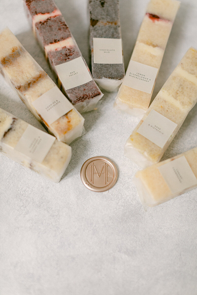 Cake slices by Holly Miller wrapped with custom wax seal featuring the HM monogram