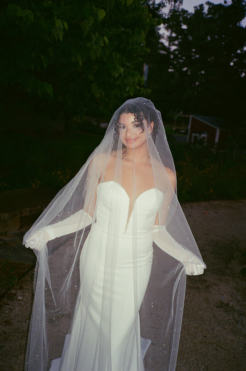 Tarayaea underneath her veil captured on 35mm film. A knoxville summer wedding.