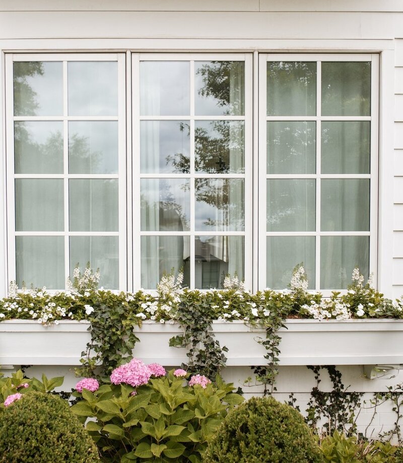Charming garden entry with stone steps, lush plants, and glowing string lights, designed by Better Lawns and Gardens to enhance curb appeal in Little Rock, Arkansas.