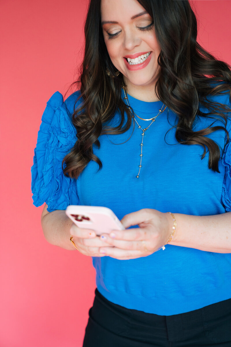 heather looking down at phone