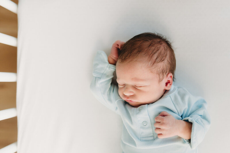 baby boy asleep in crib