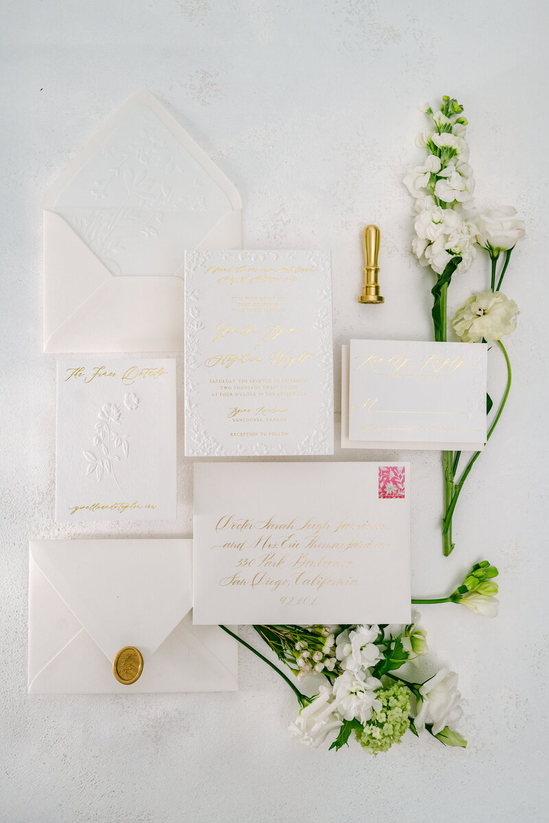 White and gold wedding invitation