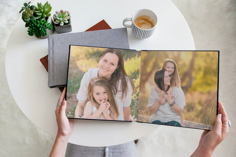 Family photographer Hampton Roads va photographs heirloom family album sitting on a coffee table