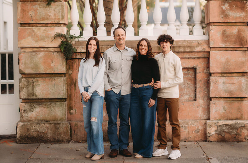 Family poses for portraits during Family Photoshoot in Charleston.