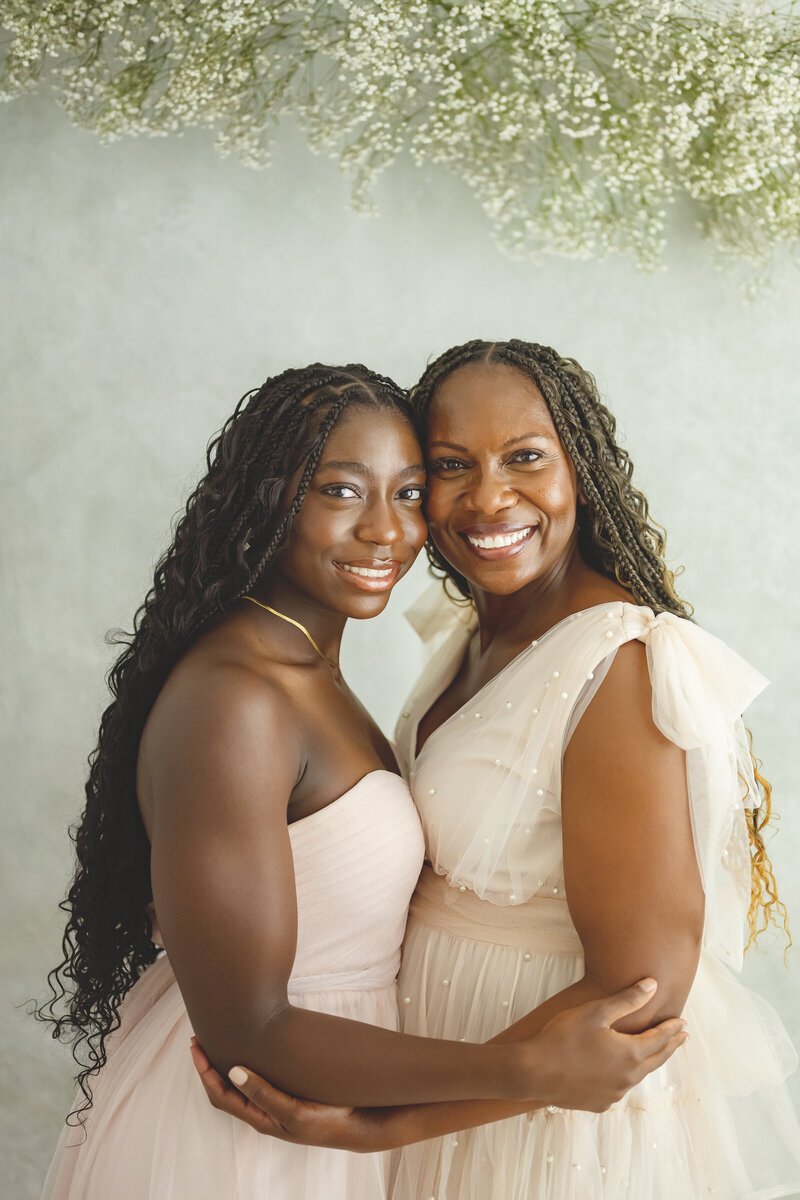 Mom and daughter hugging at their motherhood session 