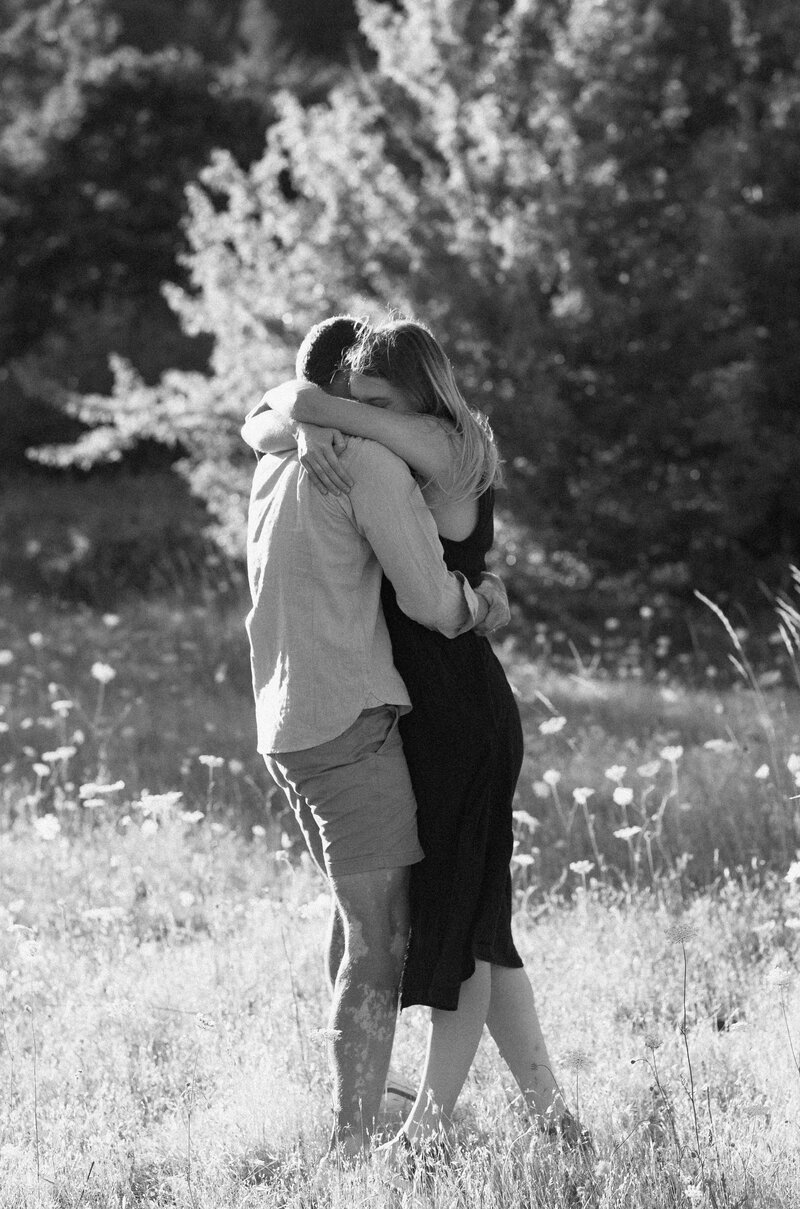 black and white photo of couple embracing